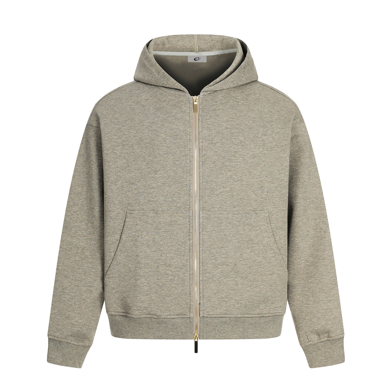 Beige zip-up hoodie with hood, front pockets, and gold zipper on a white background