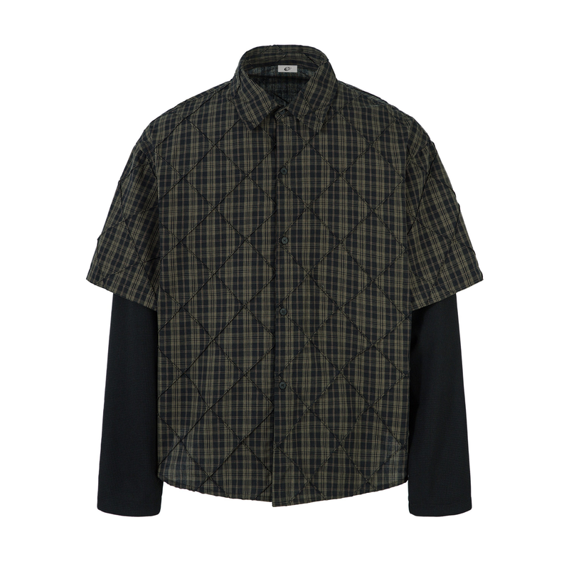 Black plaid quilted button-up shirt with short sleeves layered over long black sleeves, front view