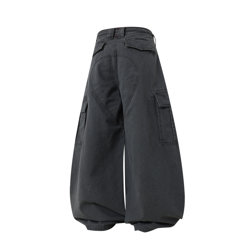 Washed black wide-leg cargo pants with curved back seam and flap pockets, back view