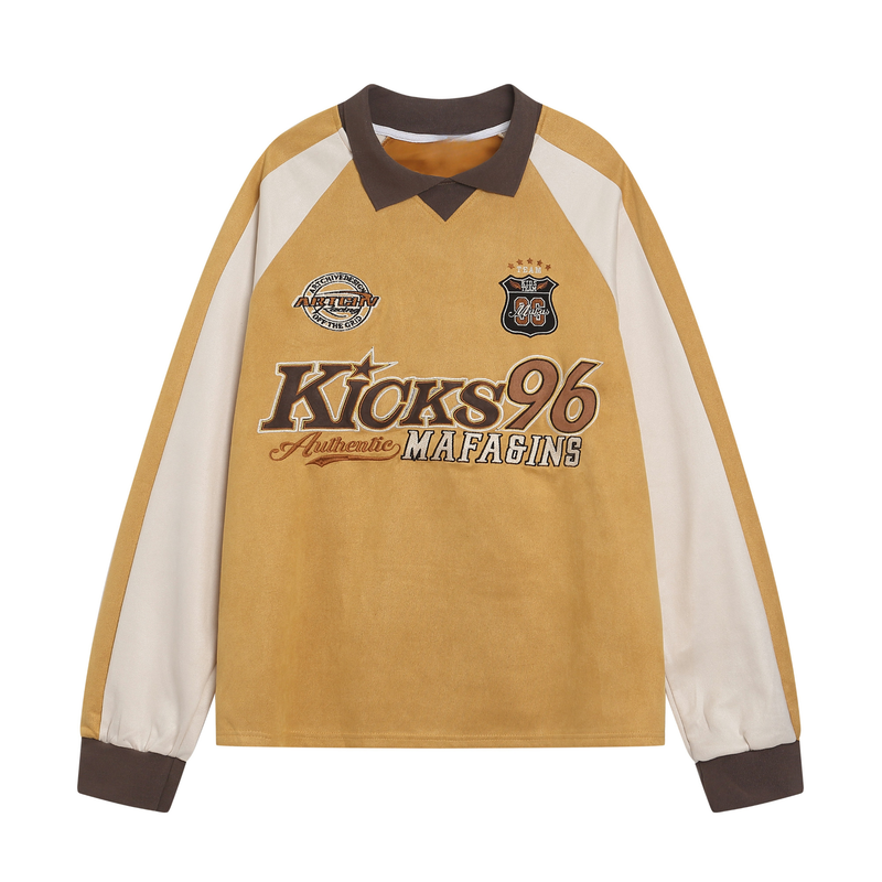 Front view of a mustard varsity rugby top with cream sleeves, brown collar, and embroidered chest patches