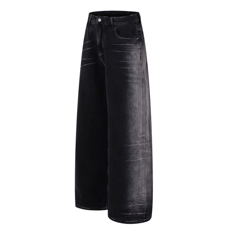 Three-quarter front view of dark wash wide-leg jeans with faded detailing and front pockets