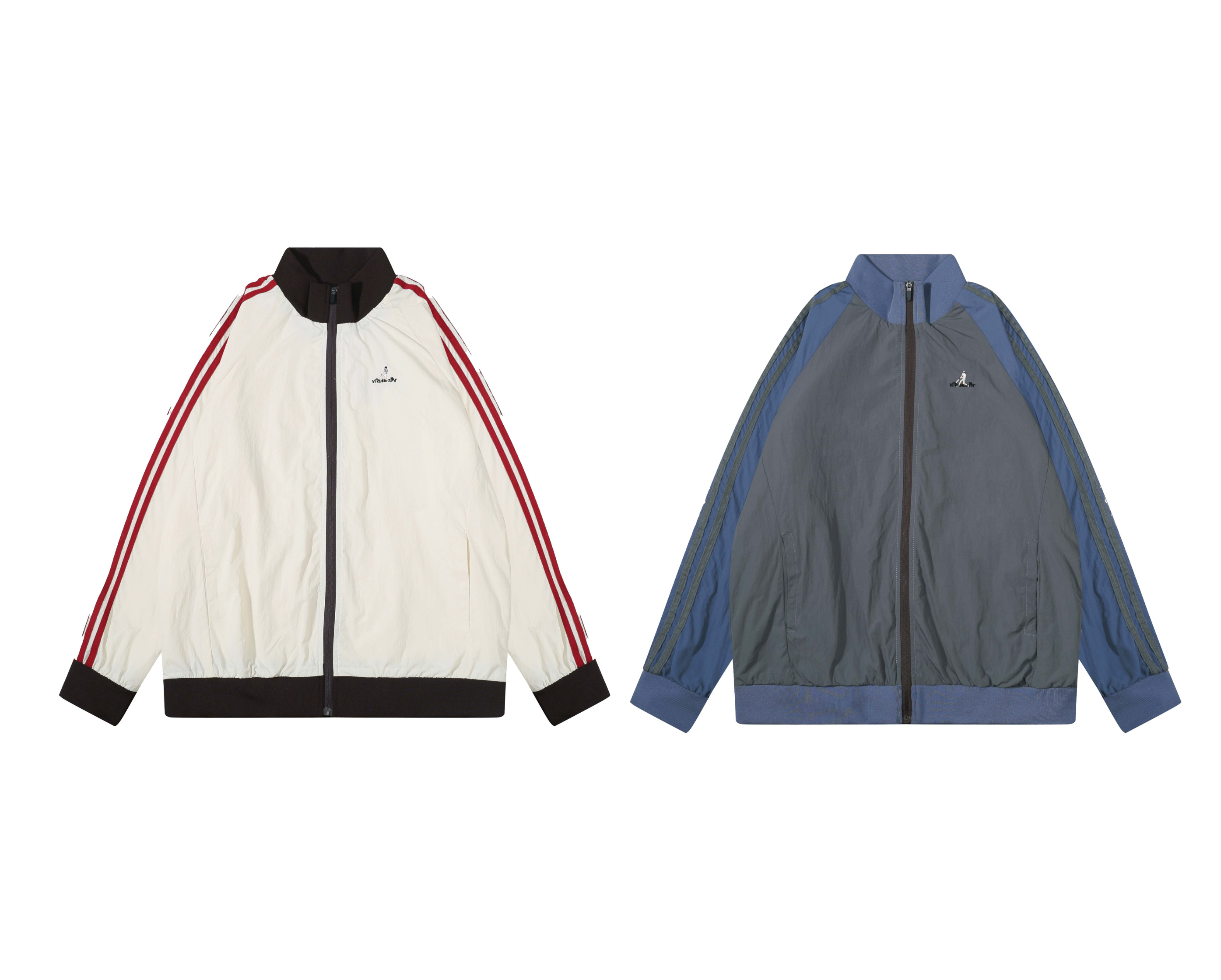 Cream and black oversized nylon track jacket with red triple-stripe sleeves, stand collar, and embroidered chest logo
