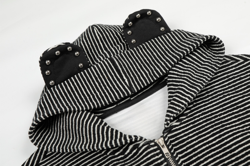 Close-up of cream striped hood with black studded bear ears