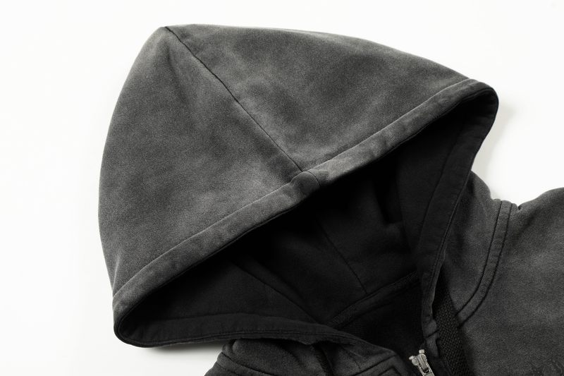 Close-up of black hoodie hood with faded wash and soft fabric texture