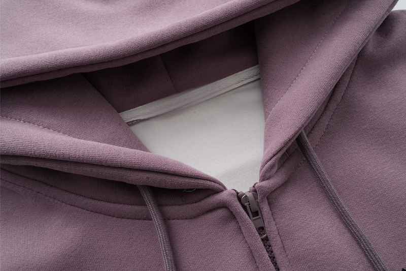 Close-up of lavender hoodie neckline and zipper with drawstrings