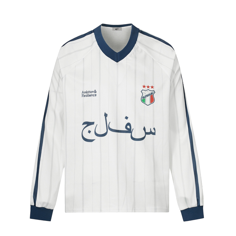 White long-sleeve football jersey with navy collar, Arabic lettering, and chest crest, front view