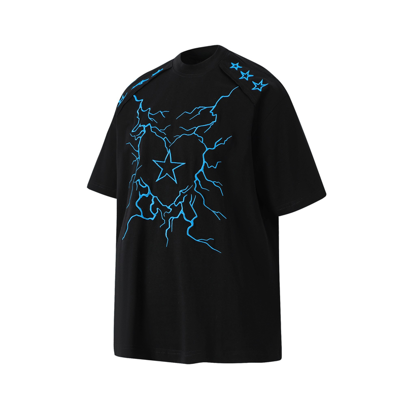 Black oversized graphic tee with bright blue lightning bolts and star accents across the chest and shoulders