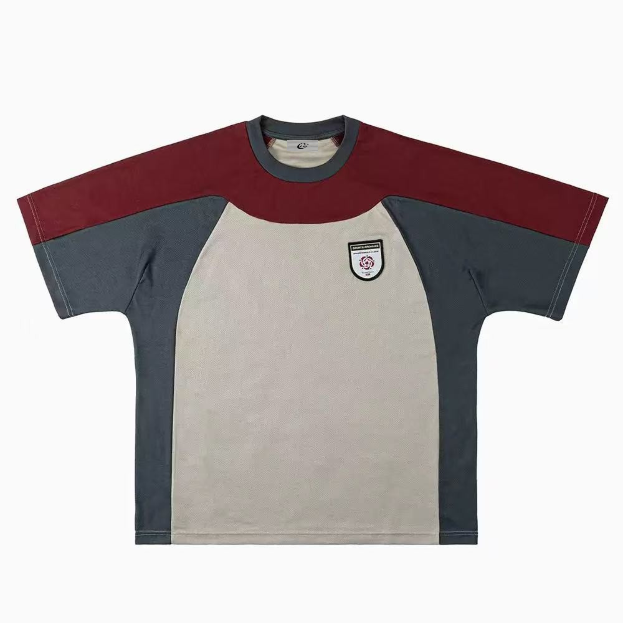Flat lay front view of oversized tri-tone colorblock t-shirt in red, grey, and beige with embroidered chest crest