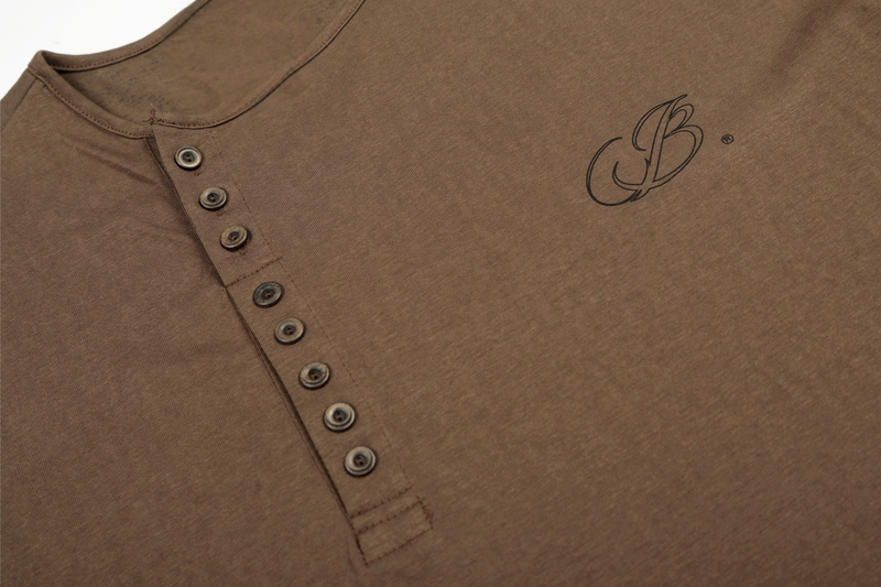 Close-up of brown Henley T-shirt button placket and chest logo