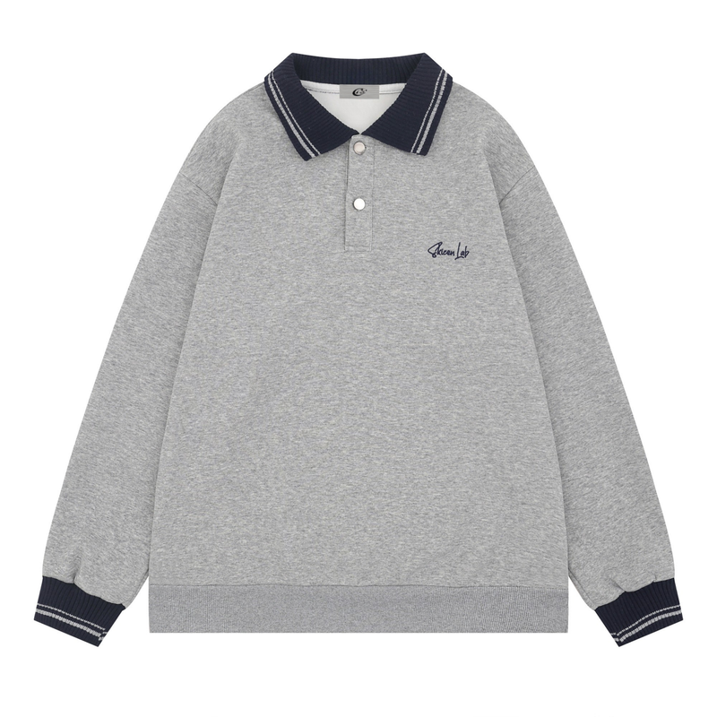 Gray varsity polo sweatshirt with navy knit collar, button placket, and striped cuffs, front view