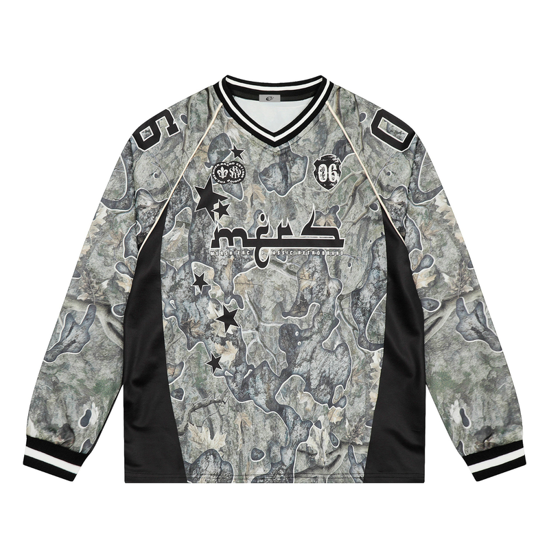 Front view of camo long-sleeve mesh jersey with black V-neck trim and chest graphics