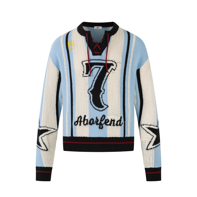 Light blue and cream knit sweater with black stripes, number 7 graphic, and lace-up V-neck
