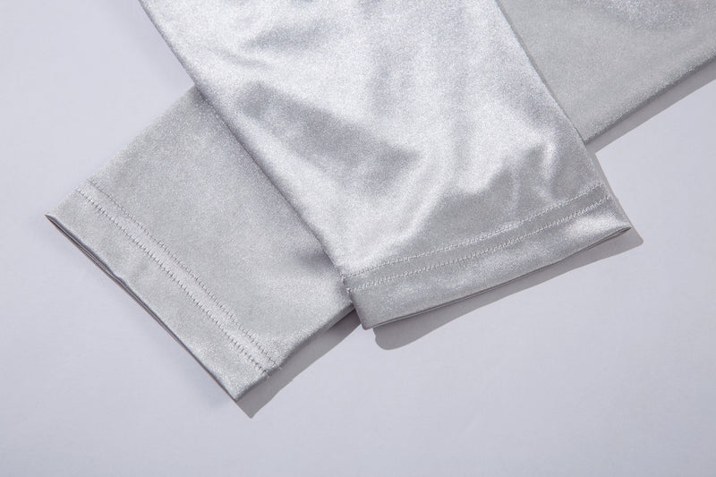 Close-up of light gray long sleeve cuff with double stitching