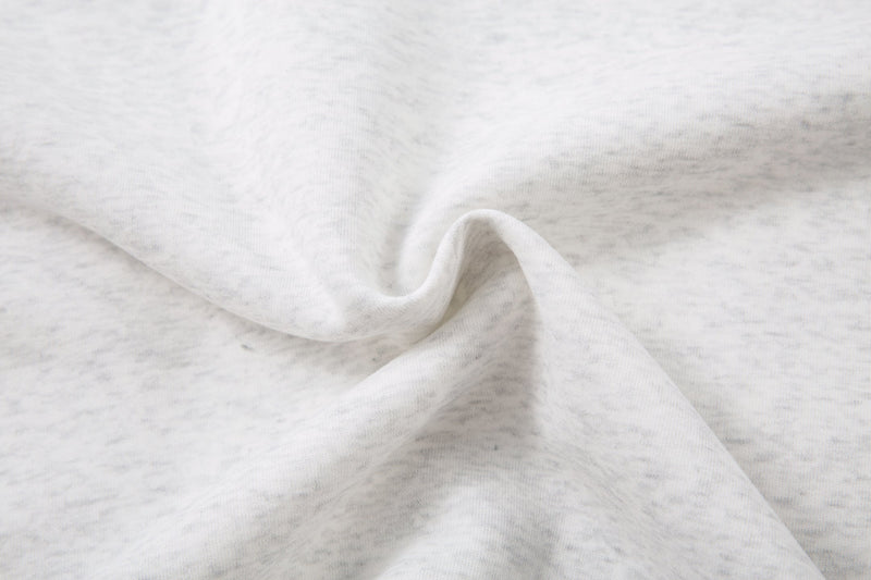 Close-up of light gray sweatshirt fabric with soft heathered texture