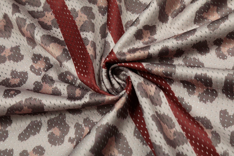 Leopard print mesh jersey fabric with red varsity stripes and sporty number-style detailing