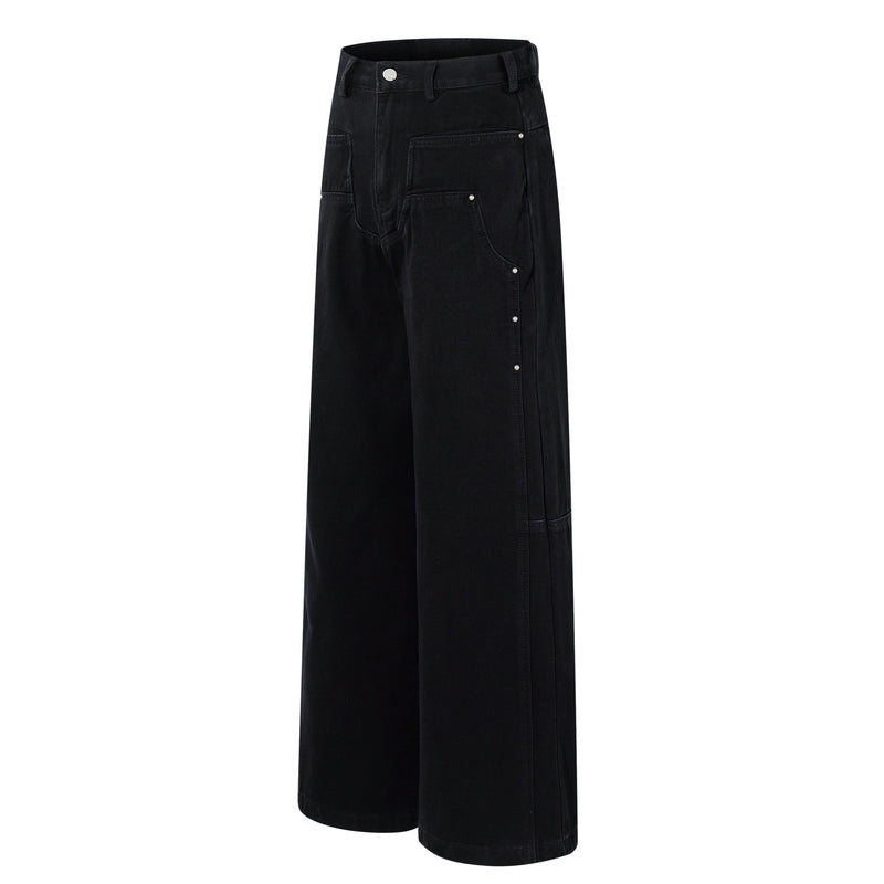Angled front view of black wide-leg jeans with studded patch pockets and a high waist