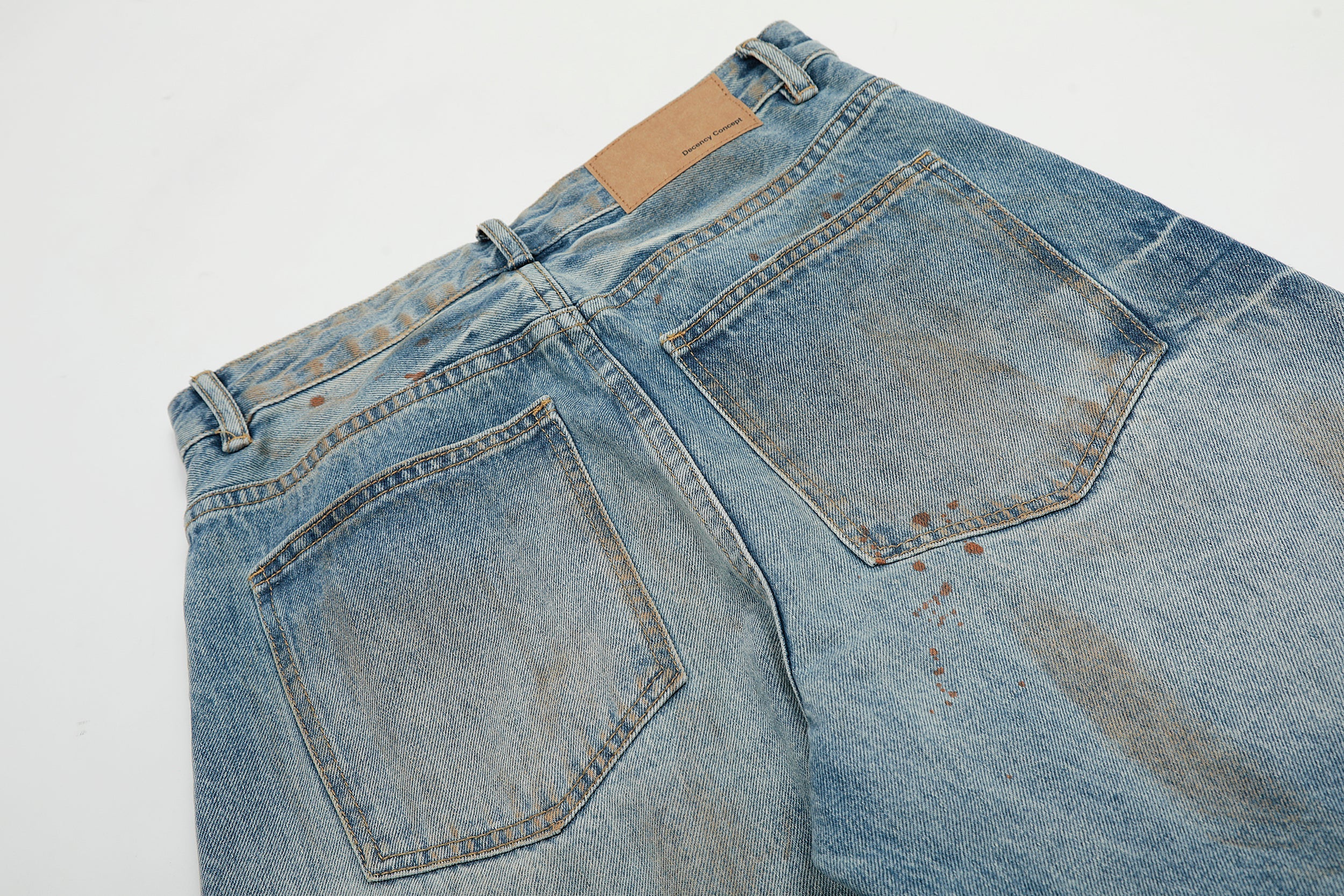 Rust-Wash Distressed Wide-Leg Jeans | Omirad