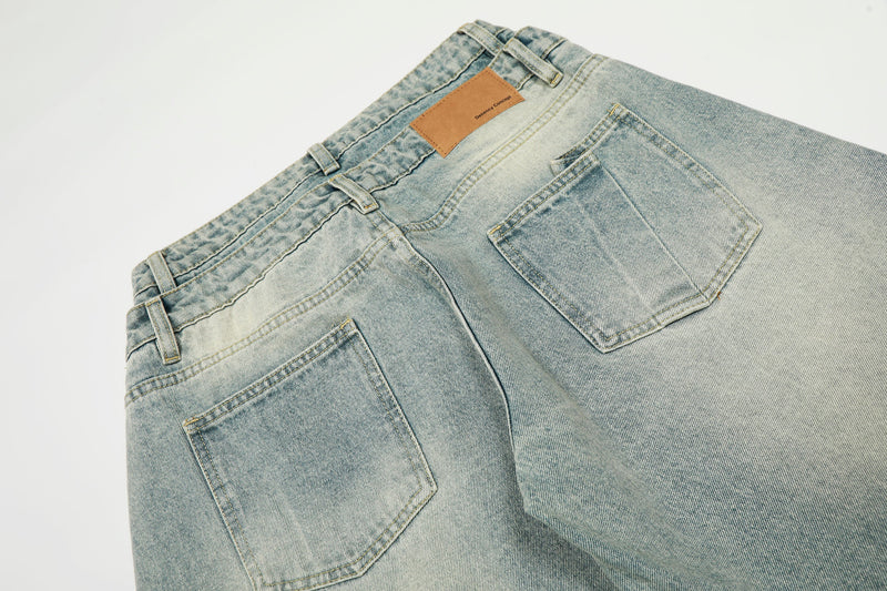 Back yoke and pocket detail on light wash double-waist vintage jeans