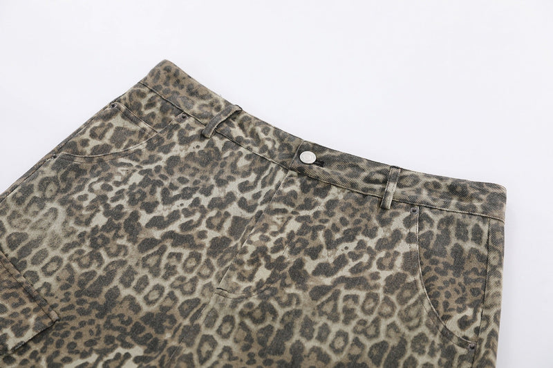 Close-up of upper front on leopard print shorts with coin pocket and button waist