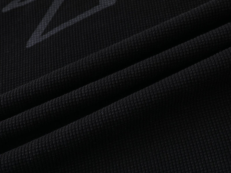 Black waffle knit T-shirt fabric with textured ribbed pattern for a Seakoff streetwear tee