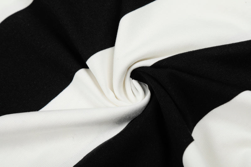 Close-up of black and white rugby stripe polo shirt fabric with soft folded texture