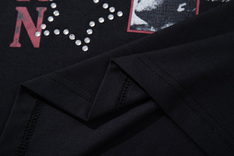 Black vintage graphic T-shirt with rhinestone star design and folded short sleeves, Y2K streetwear style