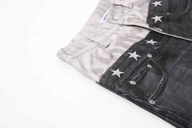 Side view of layered black and light denim jeans with angled pocket and star print