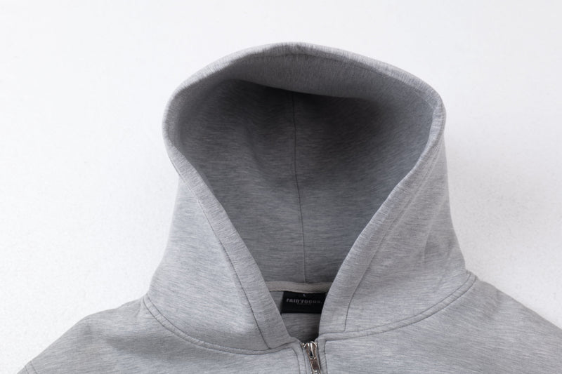 Close-up of light gray hoodie hood opening and inner lining