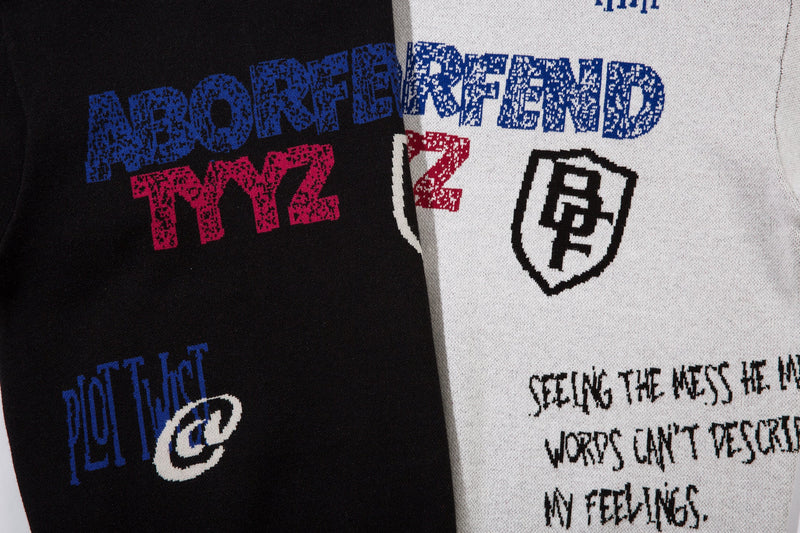 Black and white sweater front and back close-up showing blue logo text and black crest embroidery