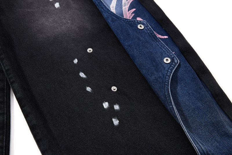 Close-up of front leg and black denim panel with white paint specks