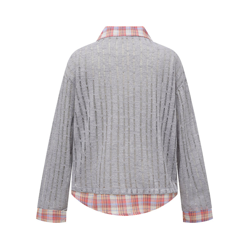 Back view of gray distressed long-sleeve shirt with red plaid collar and plaid hem
