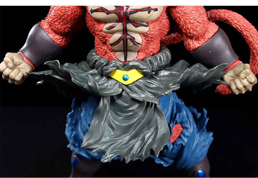 The Seakoff 33cm Super Saiyan Broly Collectible Figure from Dragon Ball Z features a muscular torso, clenched fists, textured red arms, a yellow belt accessory, and flowing gray and blue garments. It stands against a plain black backdrop.