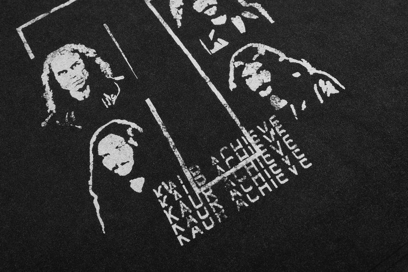 Black vintage graphic tee with distressed white band-style faces, cross lines, and stacked text print