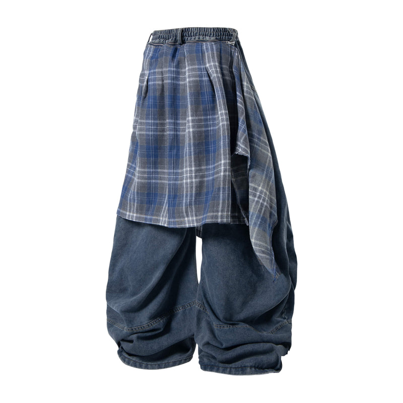 Back view of blue layered plaid baggy jeans with wide legs and plaid panels hanging at the sides