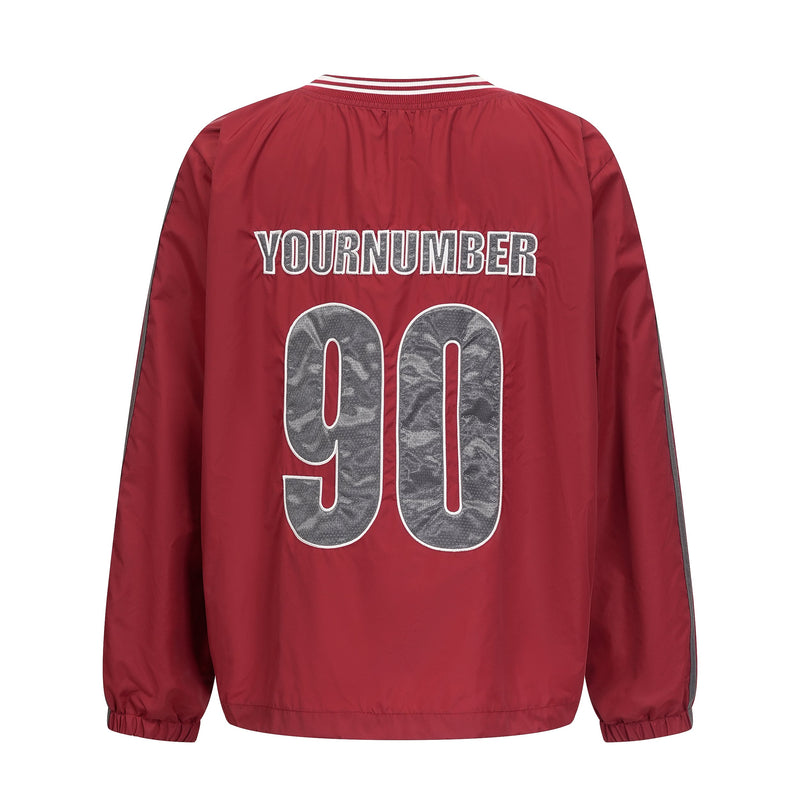 Back of burgundy nylon pullover with YOURNUMBER 90 graphic and striped collar