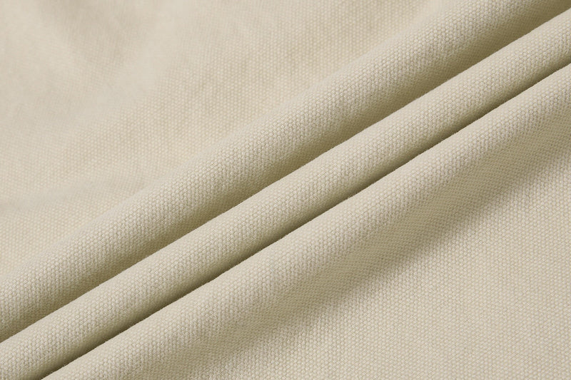 Close-up of beige cargo pant fabric texture