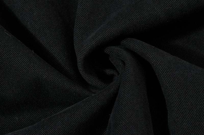 Close-up of black cotton fabric with diagonal twill texture