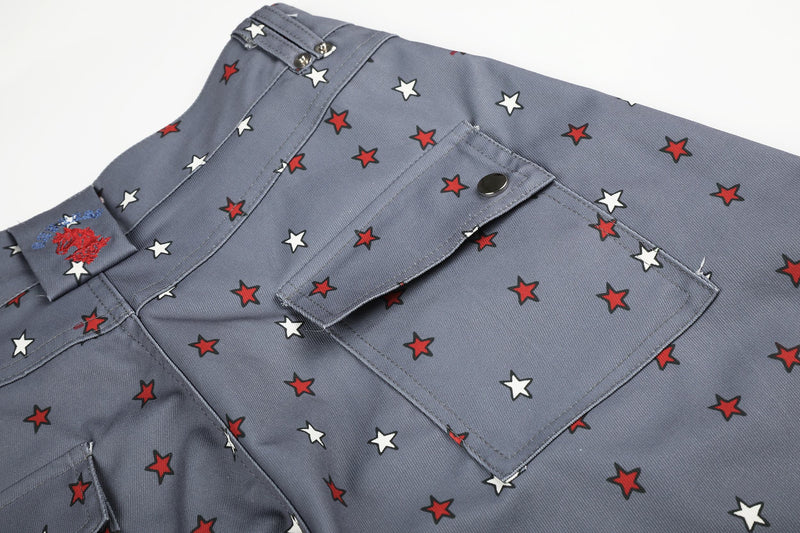 Close-up of gray star print jeans back pocket and waistband detail