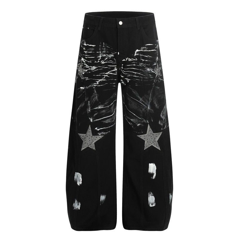 Black wide-leg jeans with white brush-stroke graphics and star patches, front view