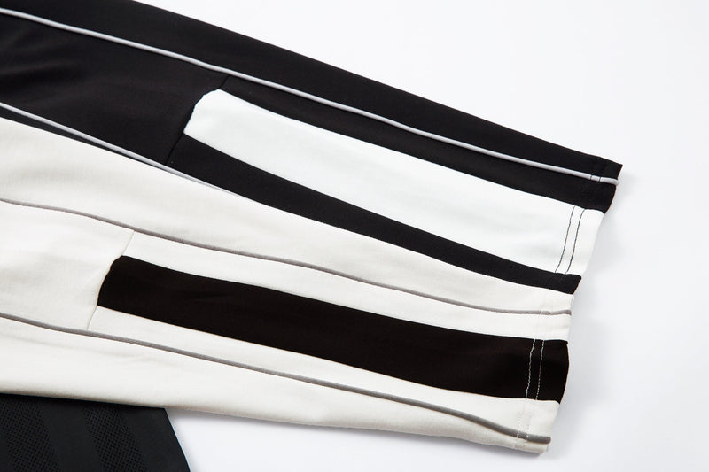 White sleeve with black stripe and contrast stitching detail