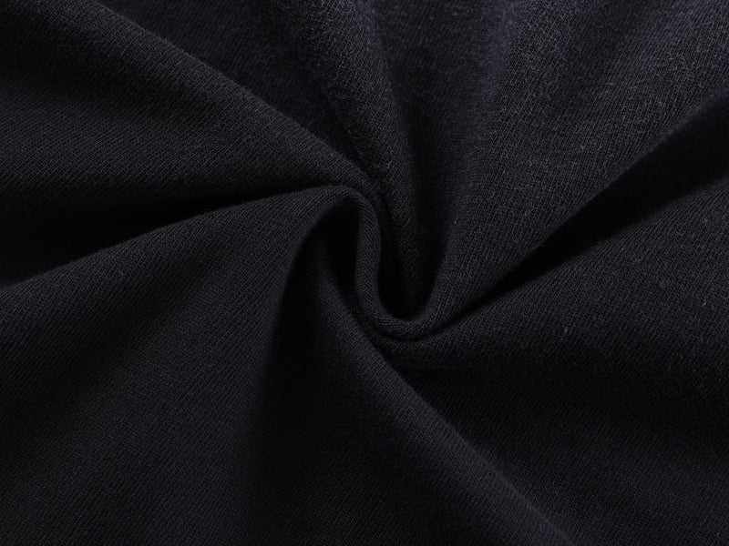 Close-up of black knit fabric with soft folded texture