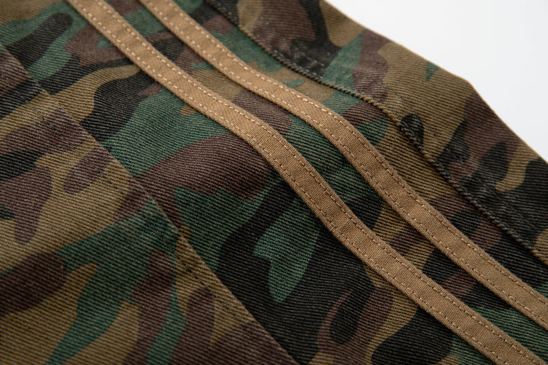 Close-up of triple side stripes on woodland camo pants leg