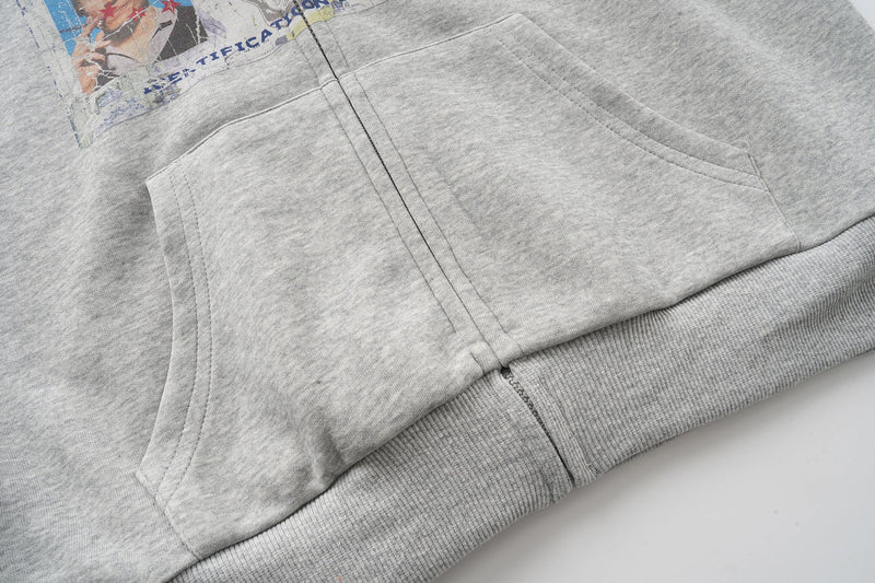 Front pocket and lower hem detail on heather grey zip hoodie