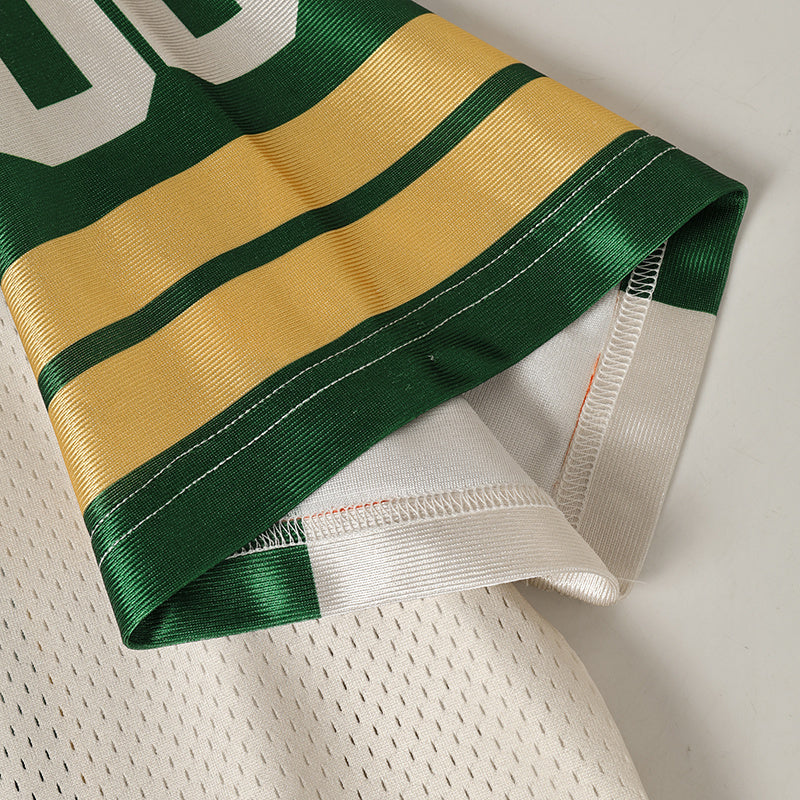 Green and gold collegiate football jersey hem with stitched white mesh lining and number 06 streetwear style