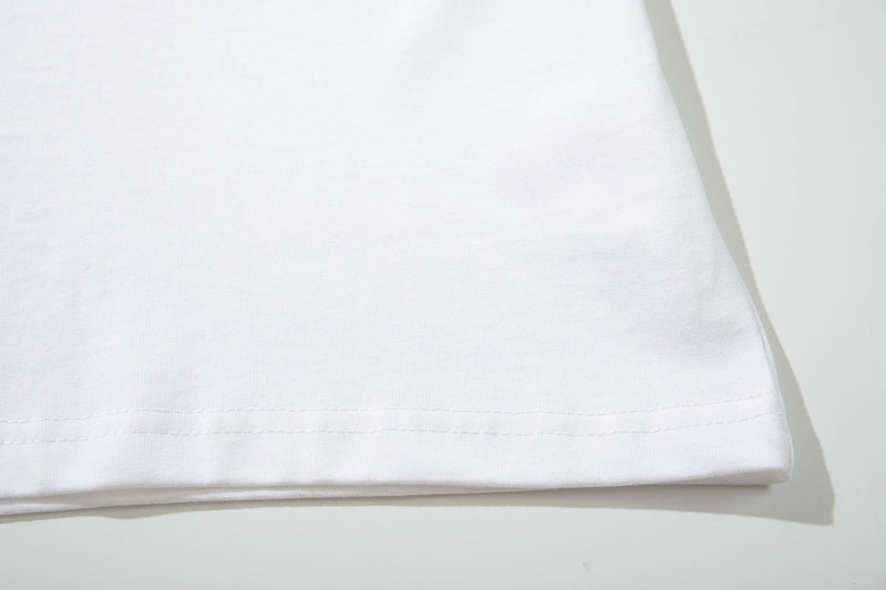 White ringer T-shirt hem close-up with soft cotton fabric and stitched detailing on a clean background