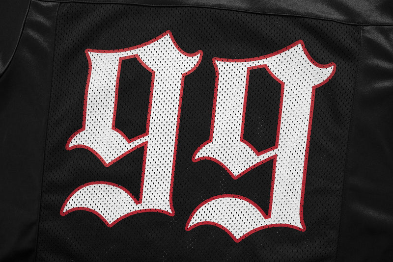 Black gothic mesh football jersey tee with oversized white lettering and red trim on the front panel
