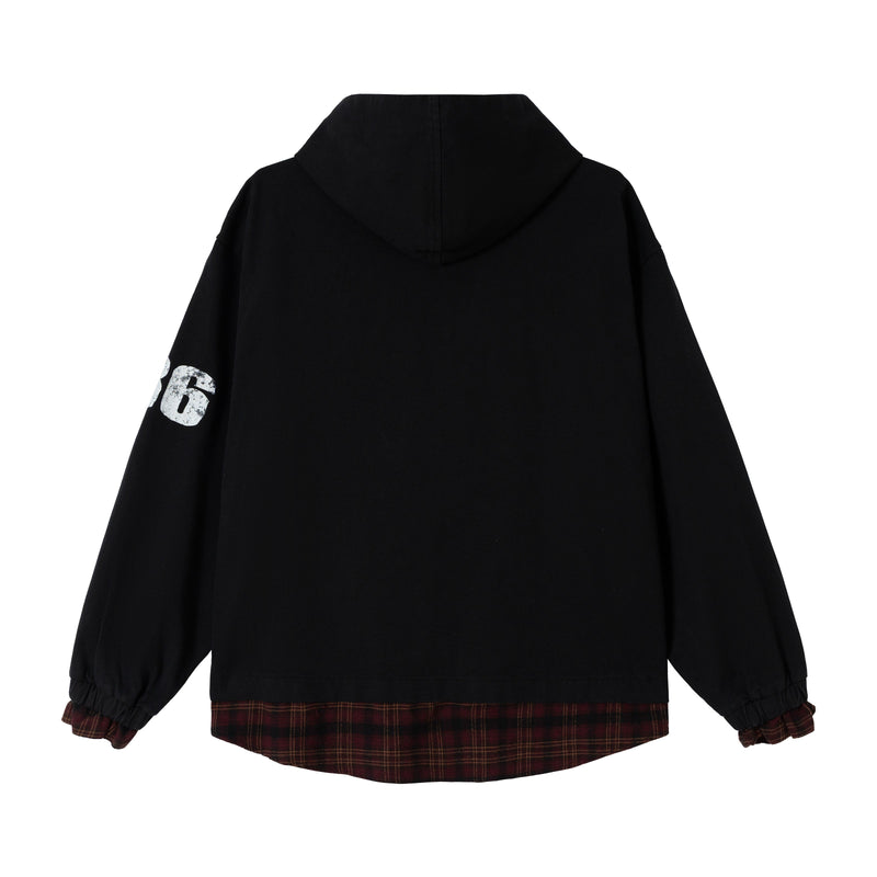 Back view of black zip hoodie with hood up, plain back, and plaid hem peeking out