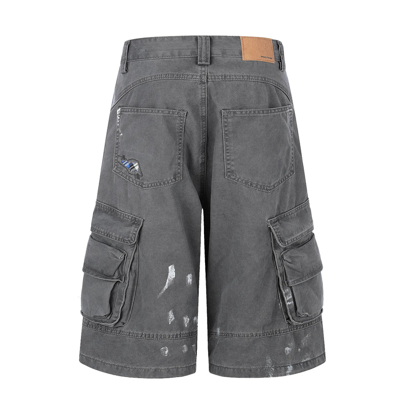 Back view of gray cargo shorts with patch pockets and distressed marks
