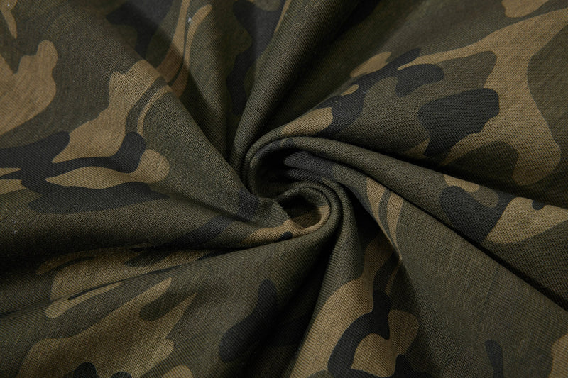 Close-up of camo-patterned fabric on an Artskate Artpark graphic T-shirt in olive, tan, and black streetwear style