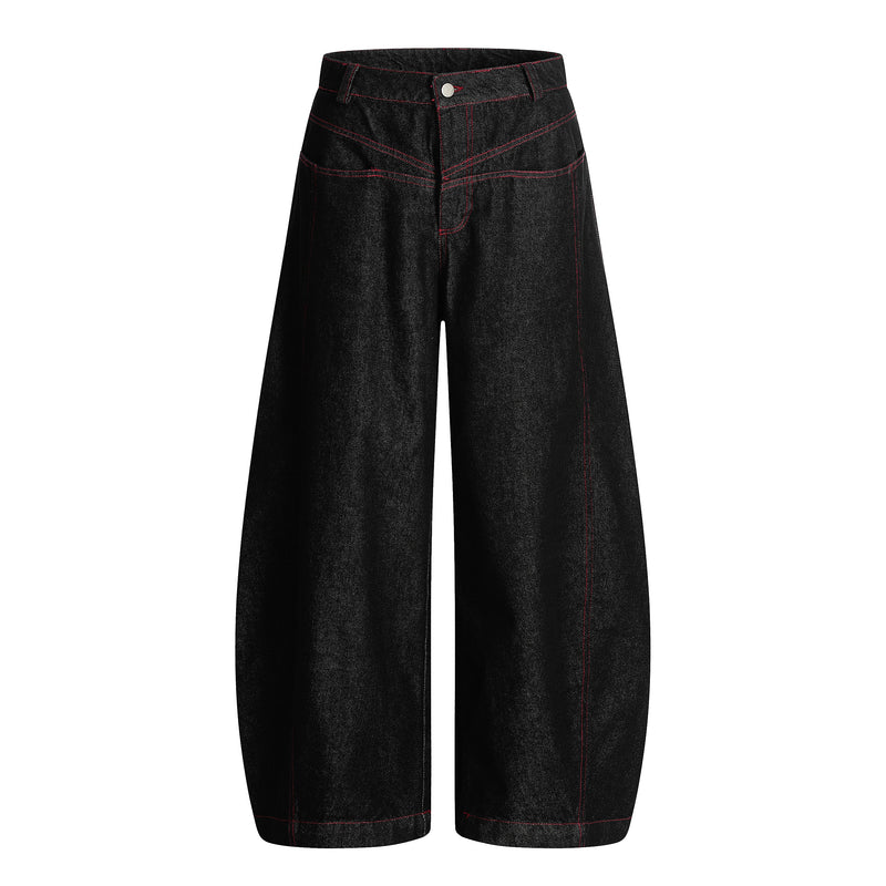 Front view of black wide leg denim pants with red stitching and high waist